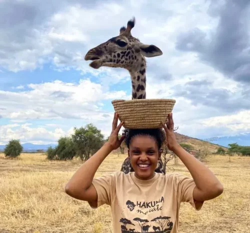 Martha Gerald with a giraffe